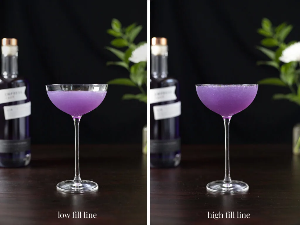 a purple cocktail filling the glass three quarters and a purple cocktail filled to the brim.
